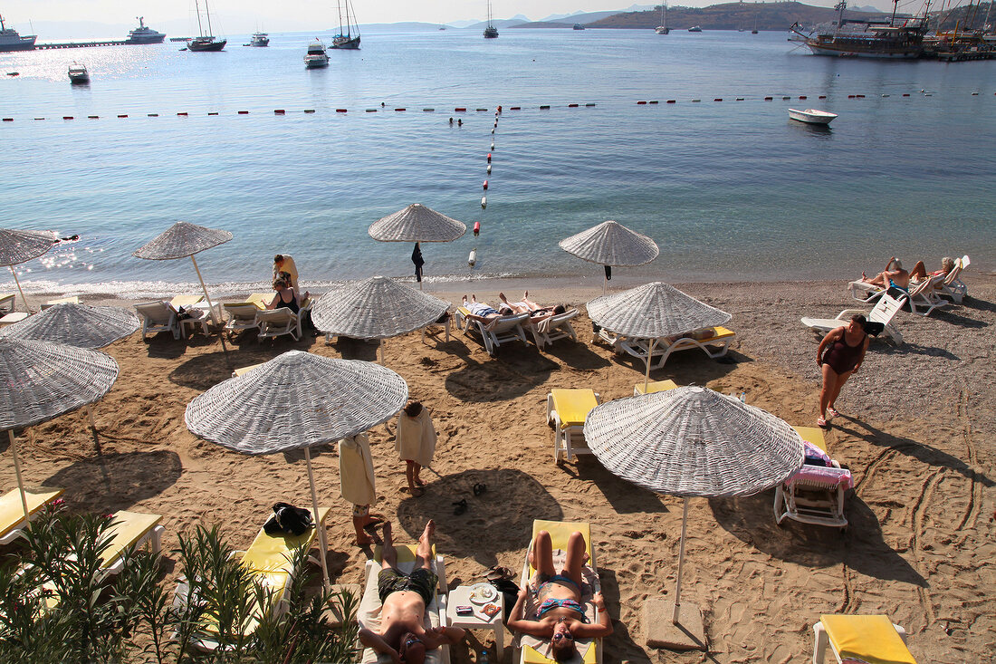 People relaxing on beach, Bodrum, Aegean Region, Turkey
