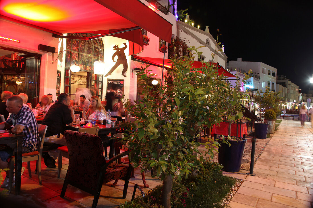 People dining at restaurant in Bodrum Peninsula at night, Aegean, Turkey