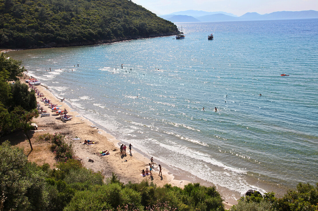 People at Icmeler beach in Dilek Peninsula National Park, Turkey