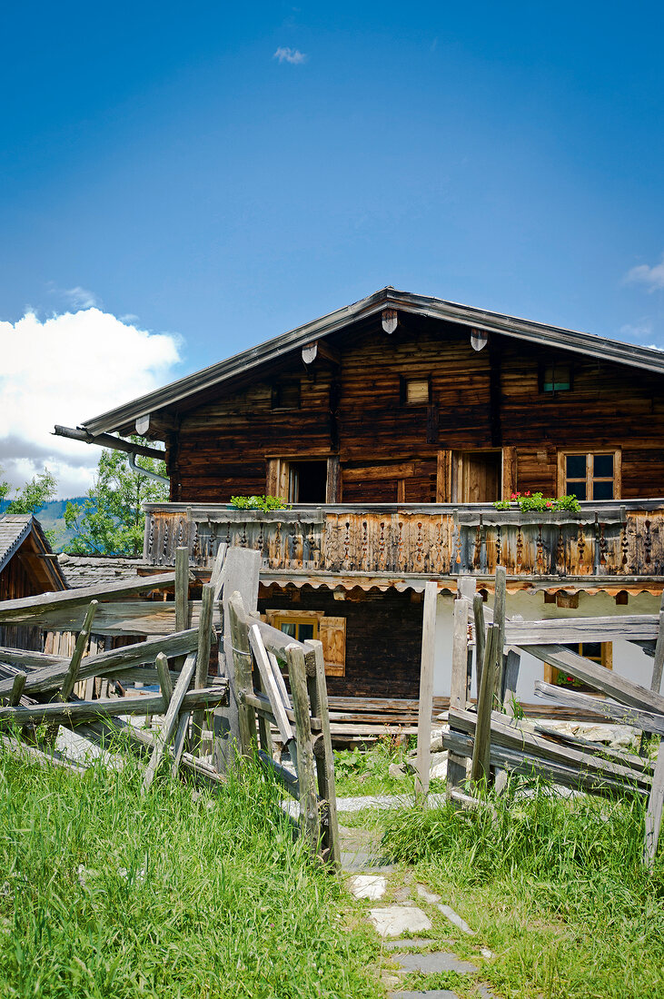 View of Alm hut with wooden fence in Kalchkendlalm, Austria
