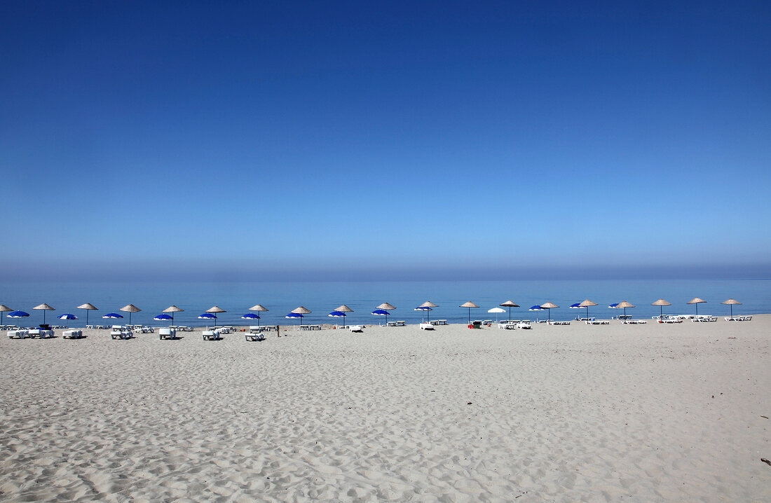 View of beach umbrellas in a row in Patara beach, Aegean Sea, Lycian, Turkey