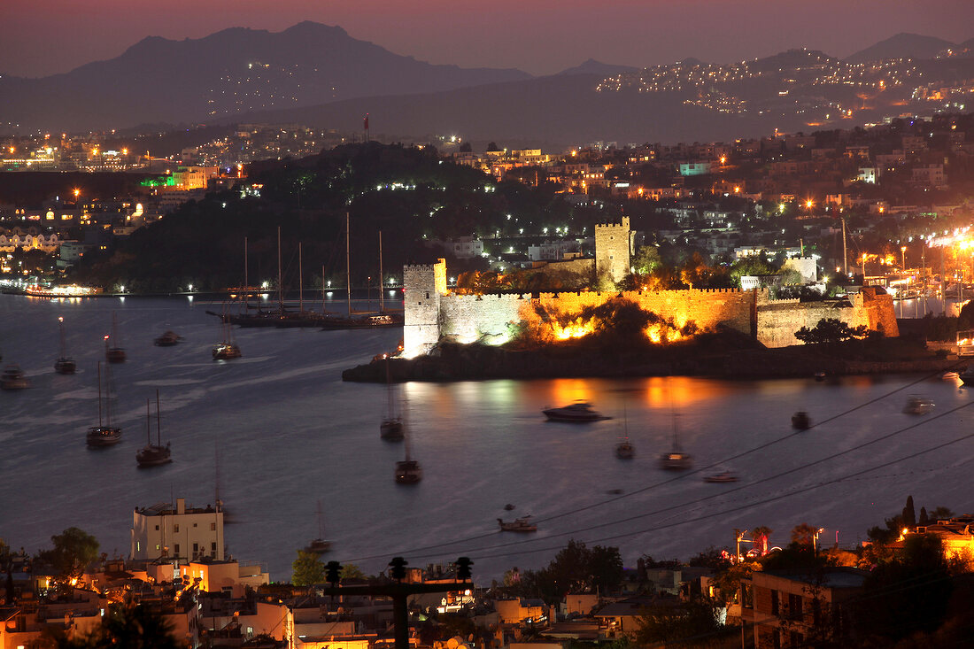 Illuminated cityscape of Bodrum at dusk, Aegean Region, Turkey