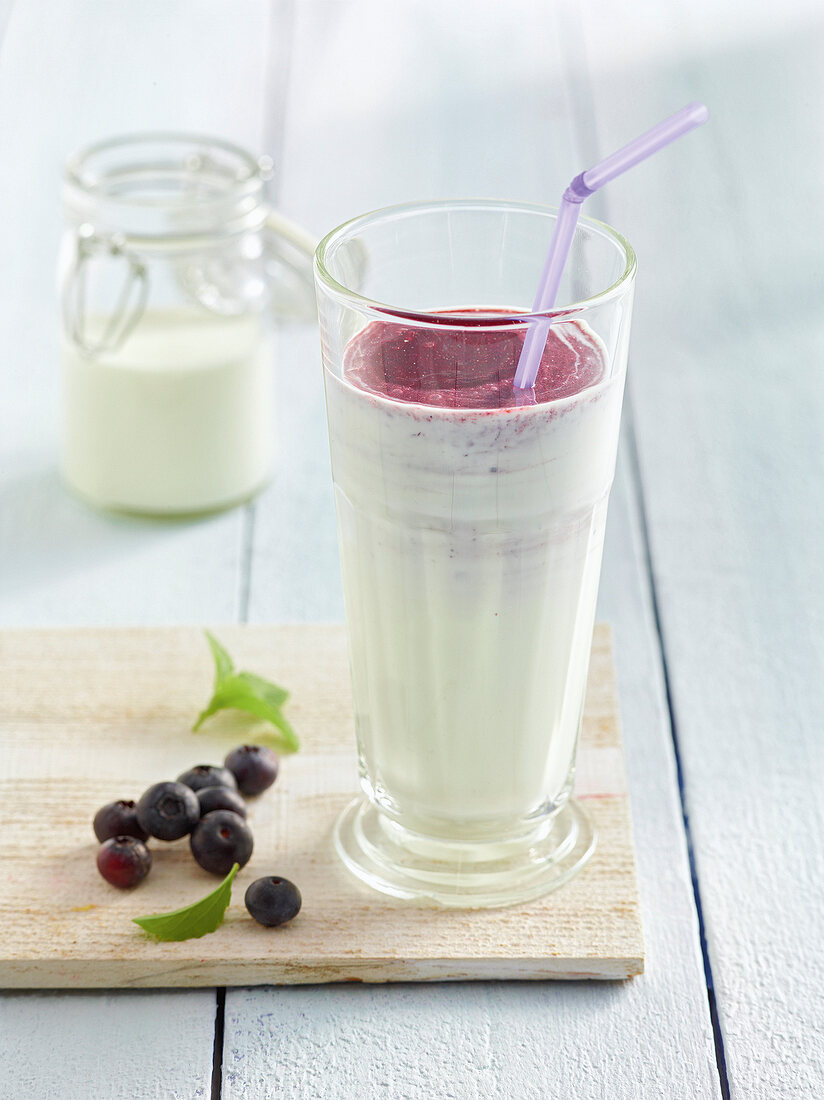 Glass of blueberry yogurt drink