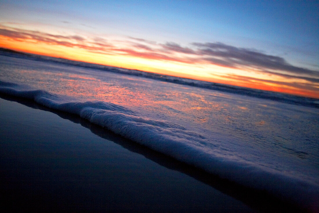 View of beach at sunset, Sylt, Germany