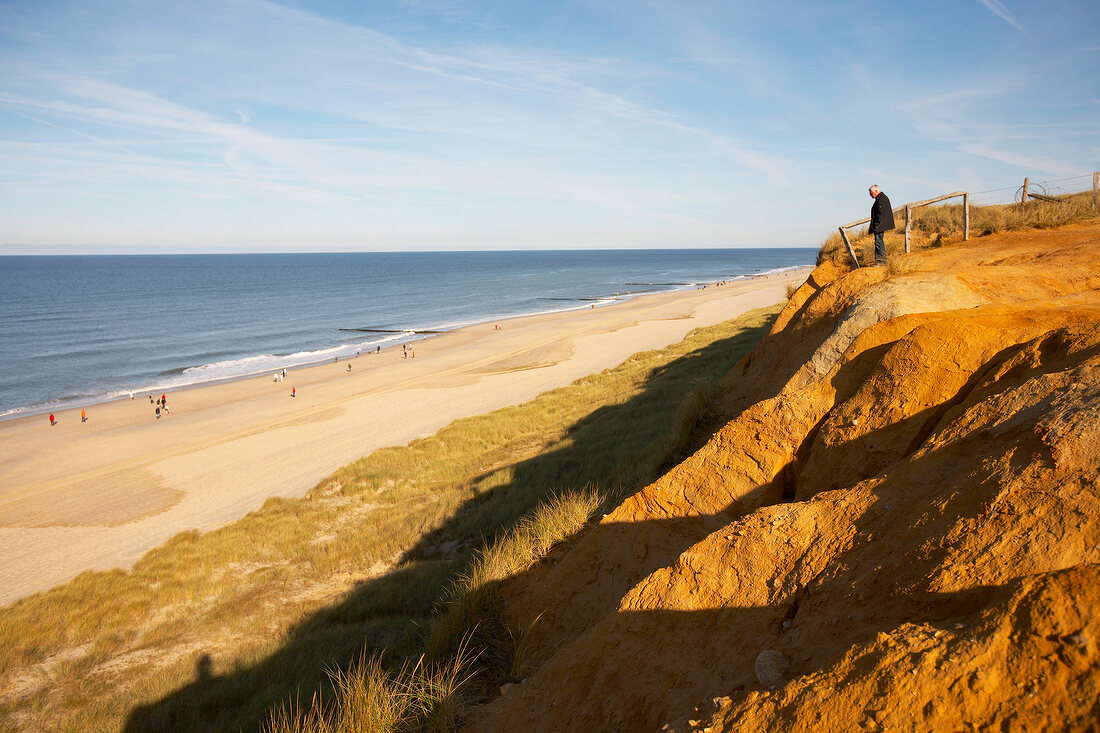 Red dunes and cliffs along beach in Sylt, Germany