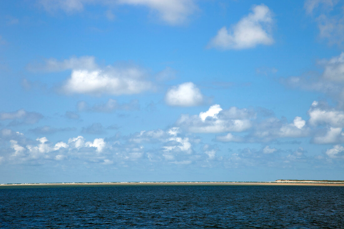 View of horizon on water and clouds in sky at Fano Beach, Denmark