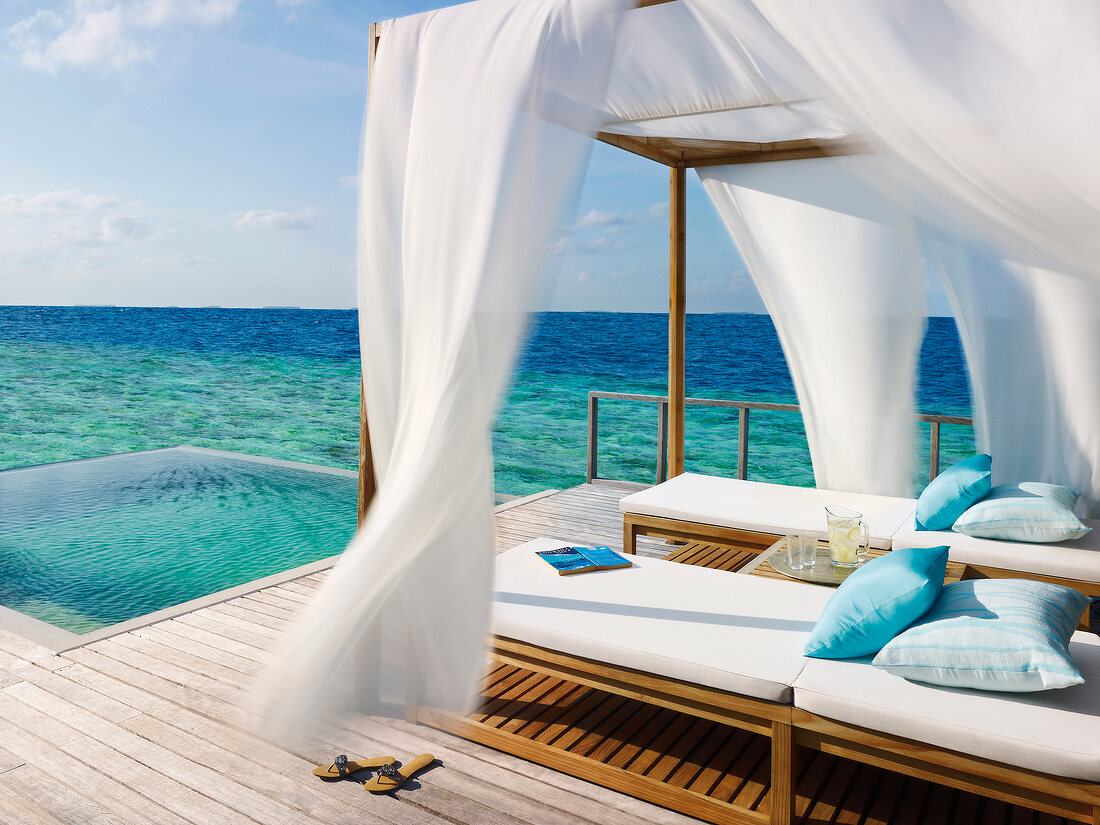 Gazebo deck with canopy next to sea