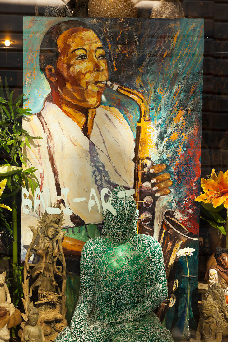 Showcase and painting of musician at Rue Saint Sulpice, Montreal, Canada