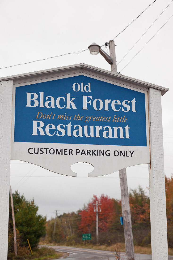 Signboard of Old Black Forest on road in Lunenburg, Nova Scotia, Canada