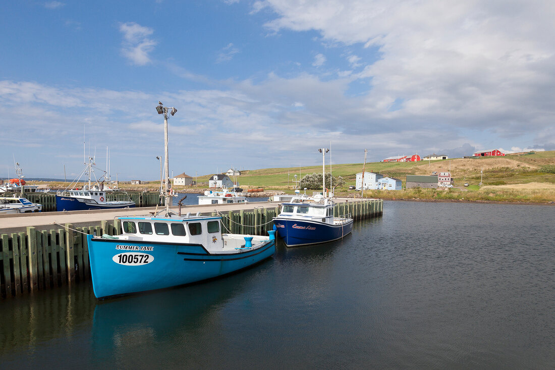 Fishing boat moored at harbor point in Cape Breton Island, Canada