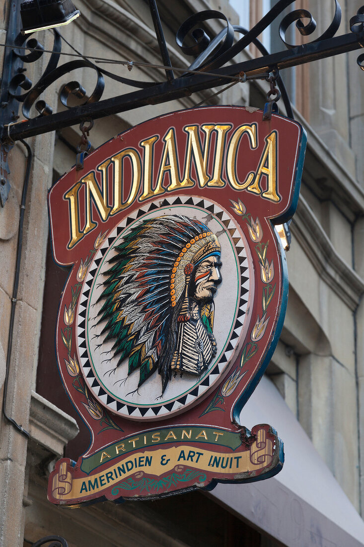 Close-up of shield of Indianica outside shop in Rue Saint Paul, Montreal, Canada