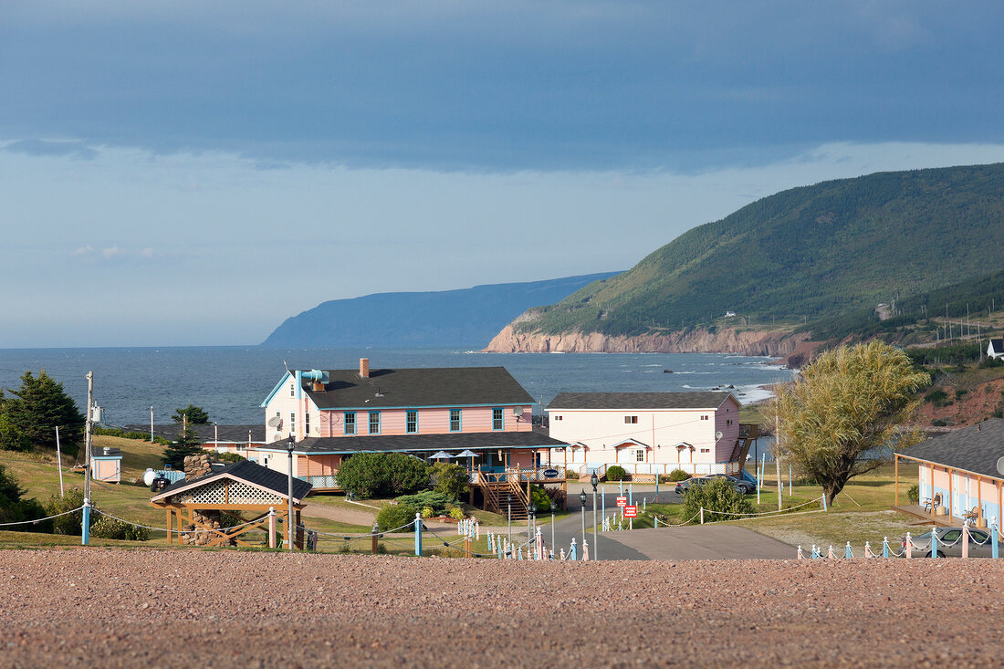 View of house and mountain near sea, Highlands National Park, Cape Breton Island, Canada