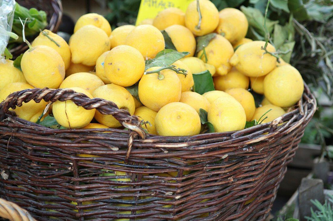 Close-up of basket of lemons in market