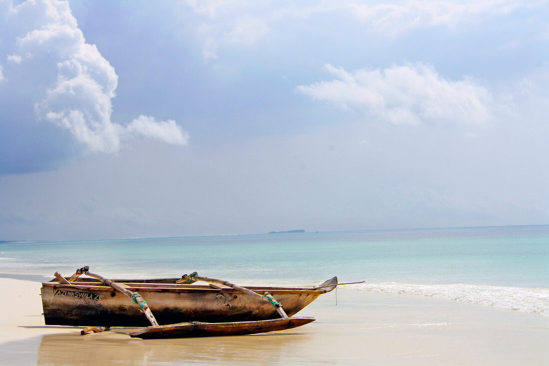 Empty boat lying on beach of Zanzibar, Tanzania, East Africa