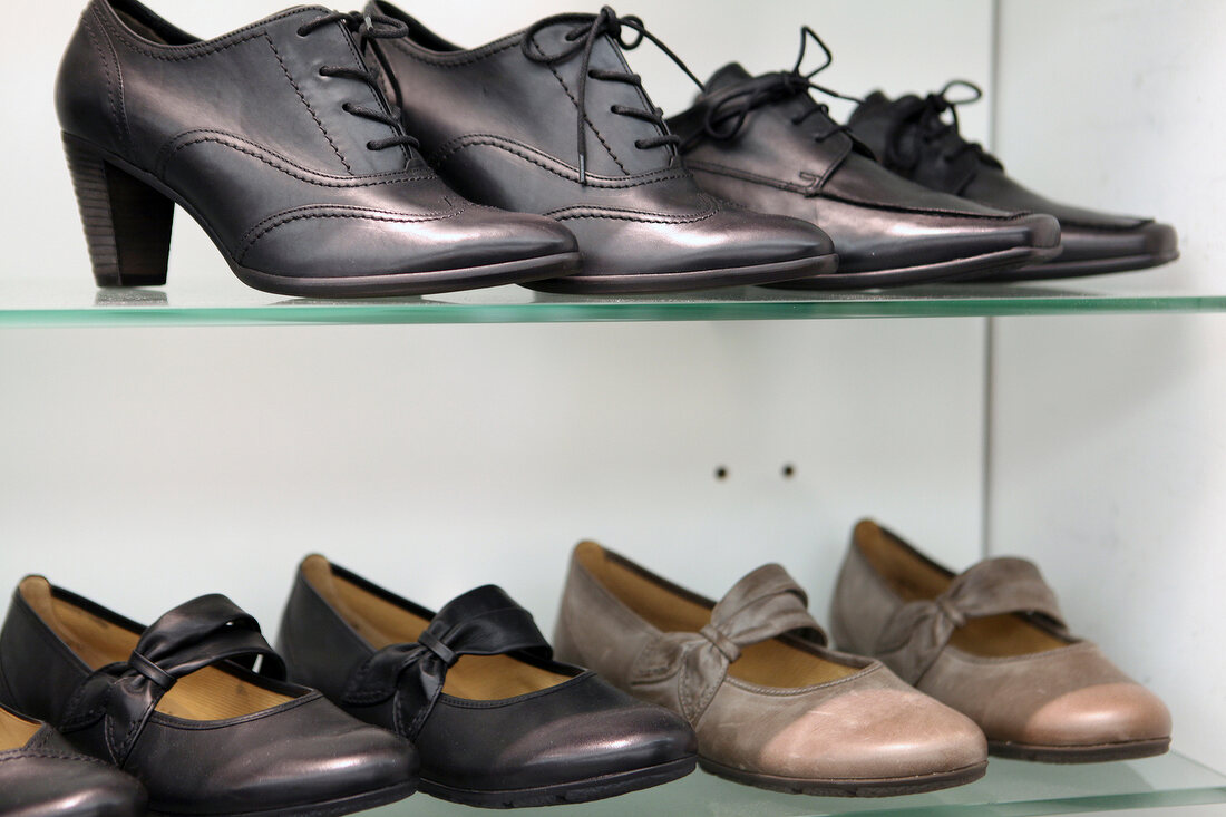 Various women's shoes on display at shoe merchandiser