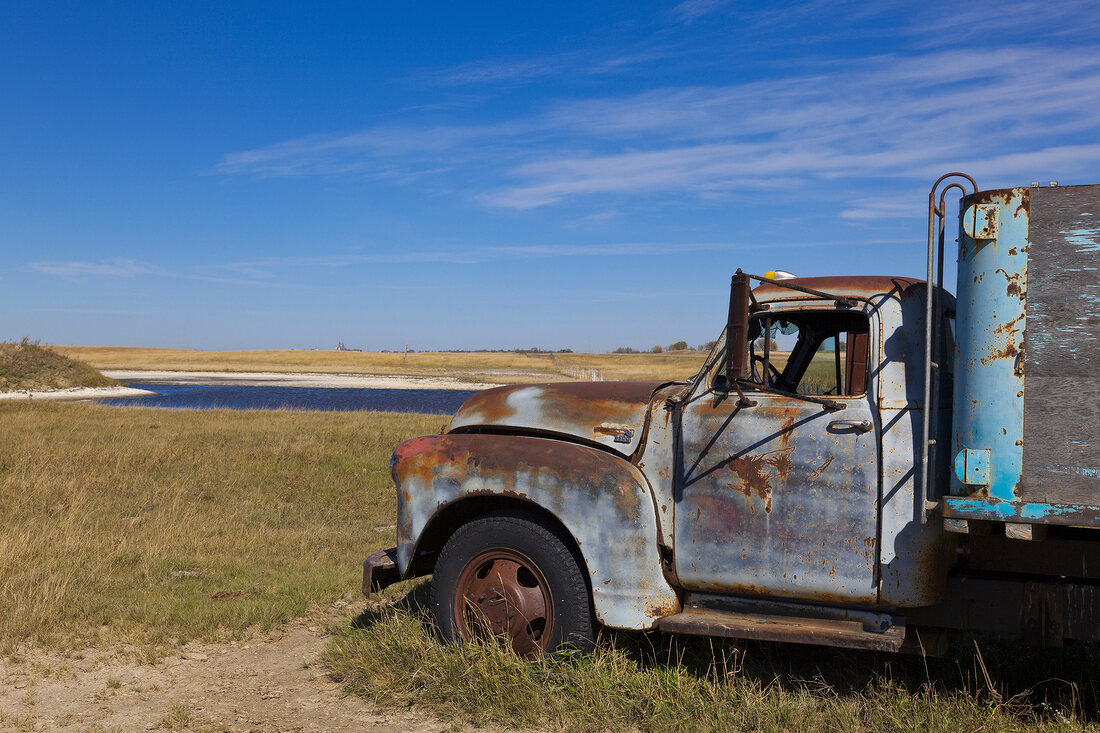 View of old truck on landscape at Highway 20, Saskatchewan, Canada