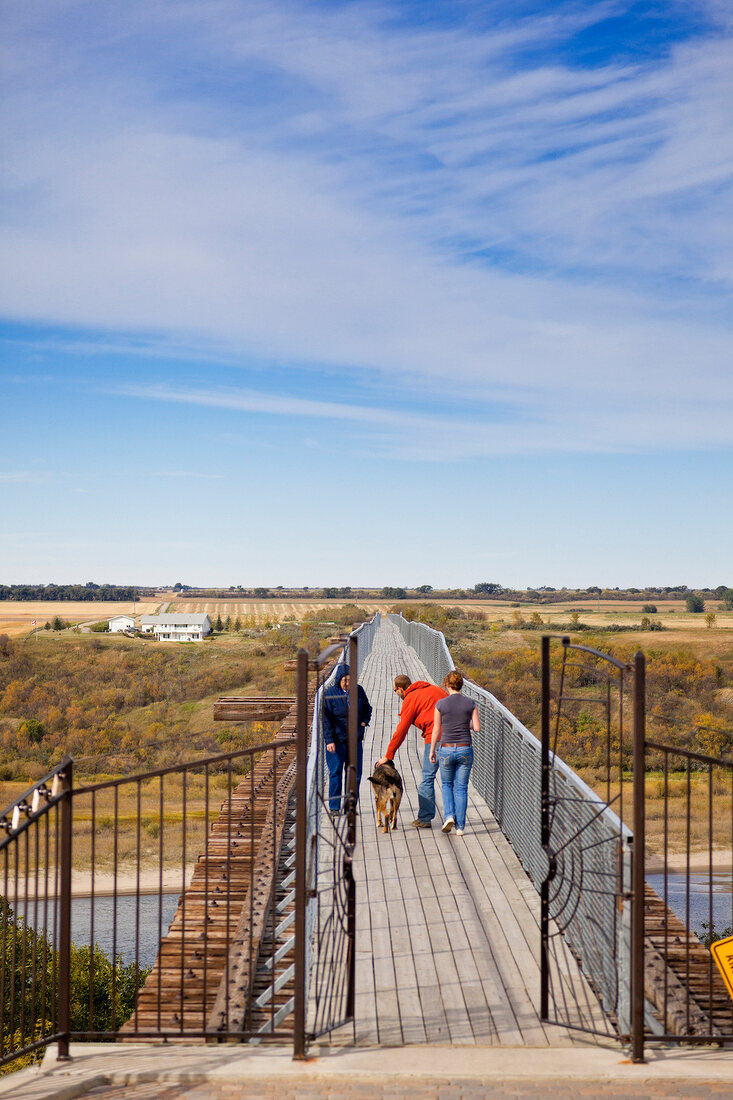 People walking on bridge in Saskatchewan, Canada