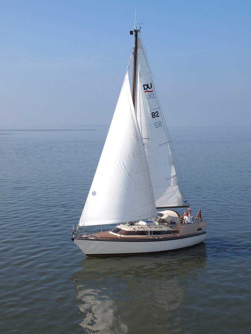 Sailboat in sea at Spiekeroog, Lower Saxony, Germany