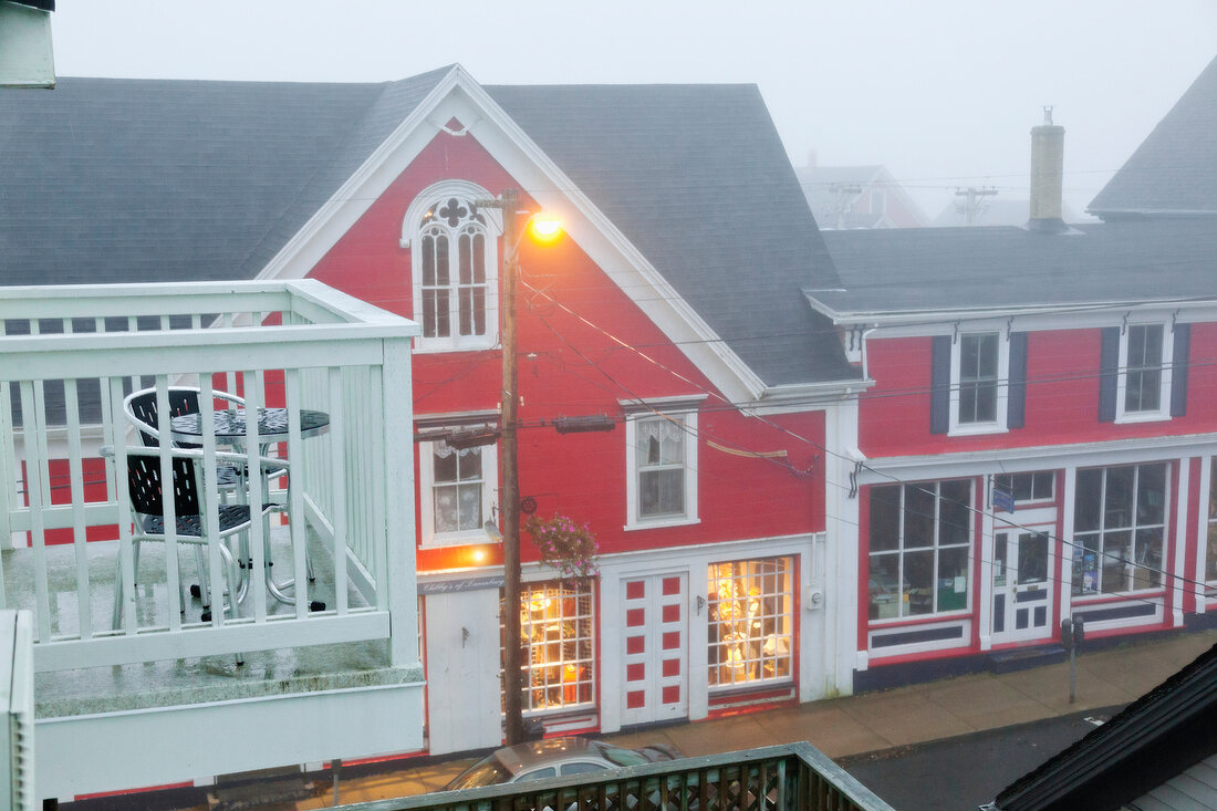 Elevated view of Smugglers Inn Hotel with fog, Nova Scotia, Canada