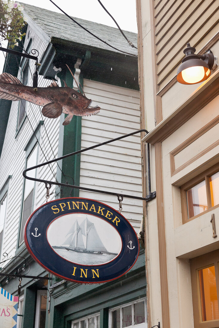 Low angle view of Spinnaker Inn sign on facade, Nova Scotia, Canada