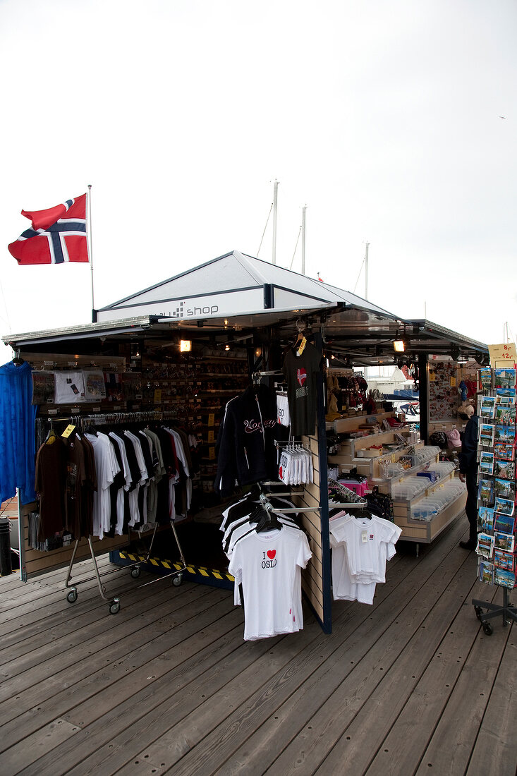 Souvenir shop on bar terrace with Norwegian flag in Oslo, Norway