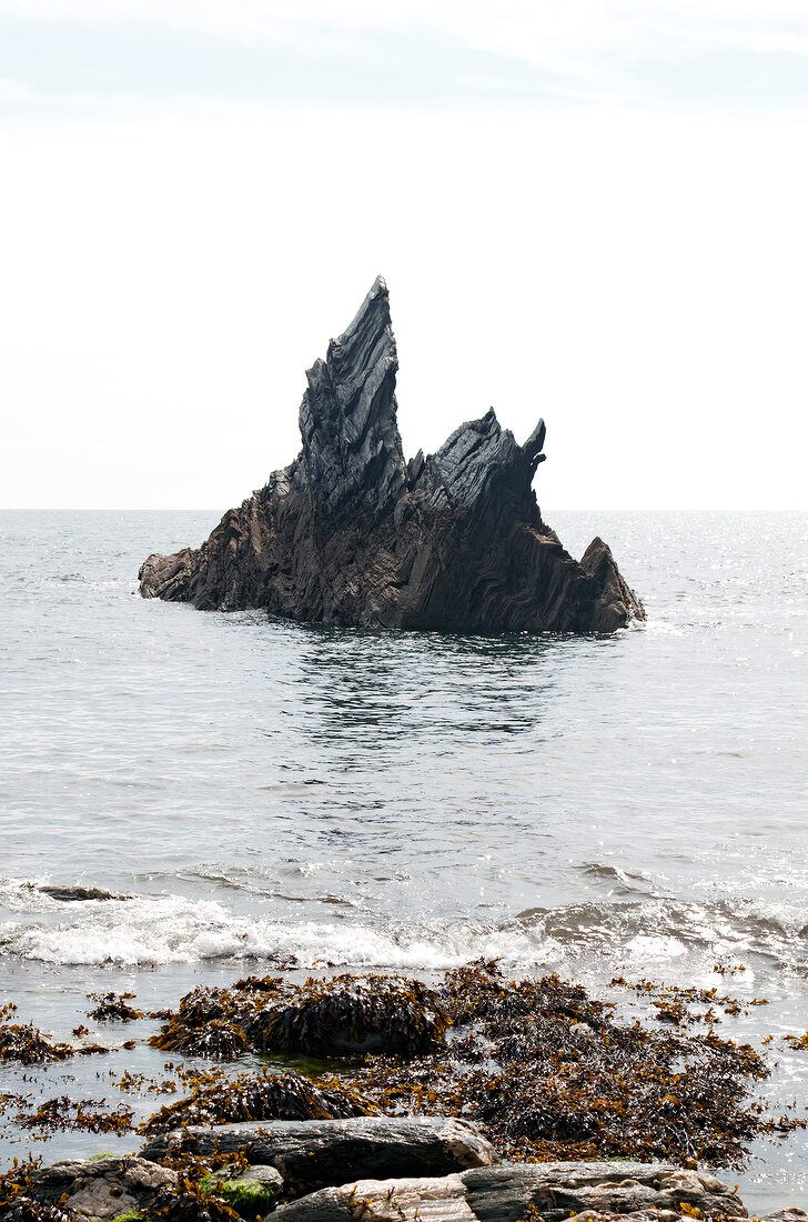 View of rock formation in sea at Devon, England
