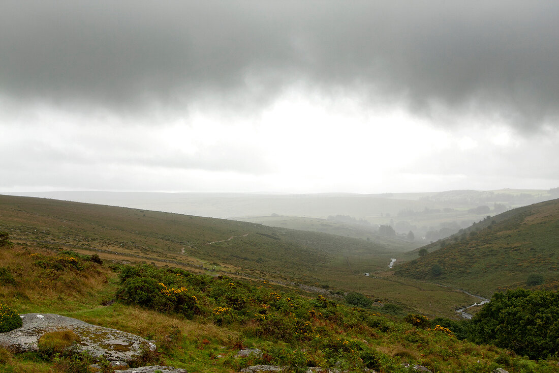 View of dark clouds and rainy weather in Dartmoor, Devon, England