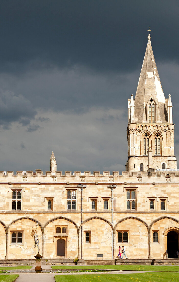 Exterior of cathedral with dark clouds in Oxford, England
