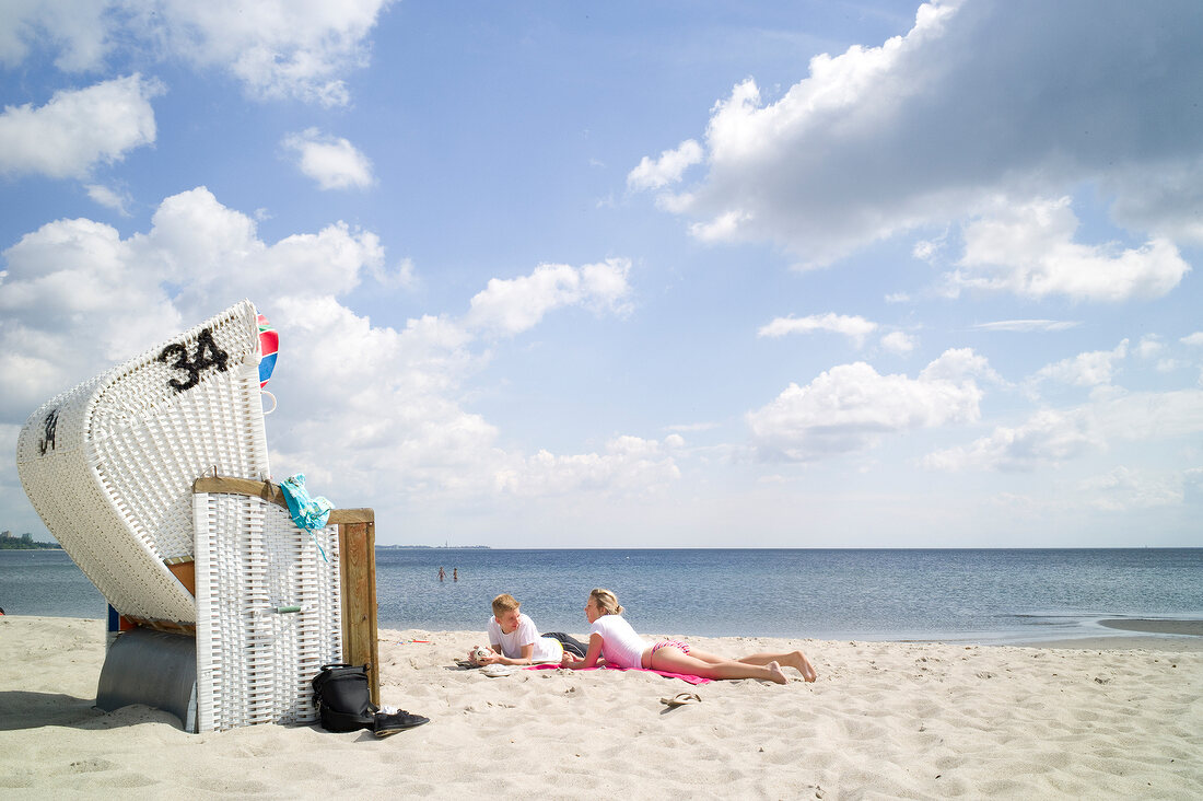 People relaxing on Haffkrug beach in Schleswig Holstein, Germany