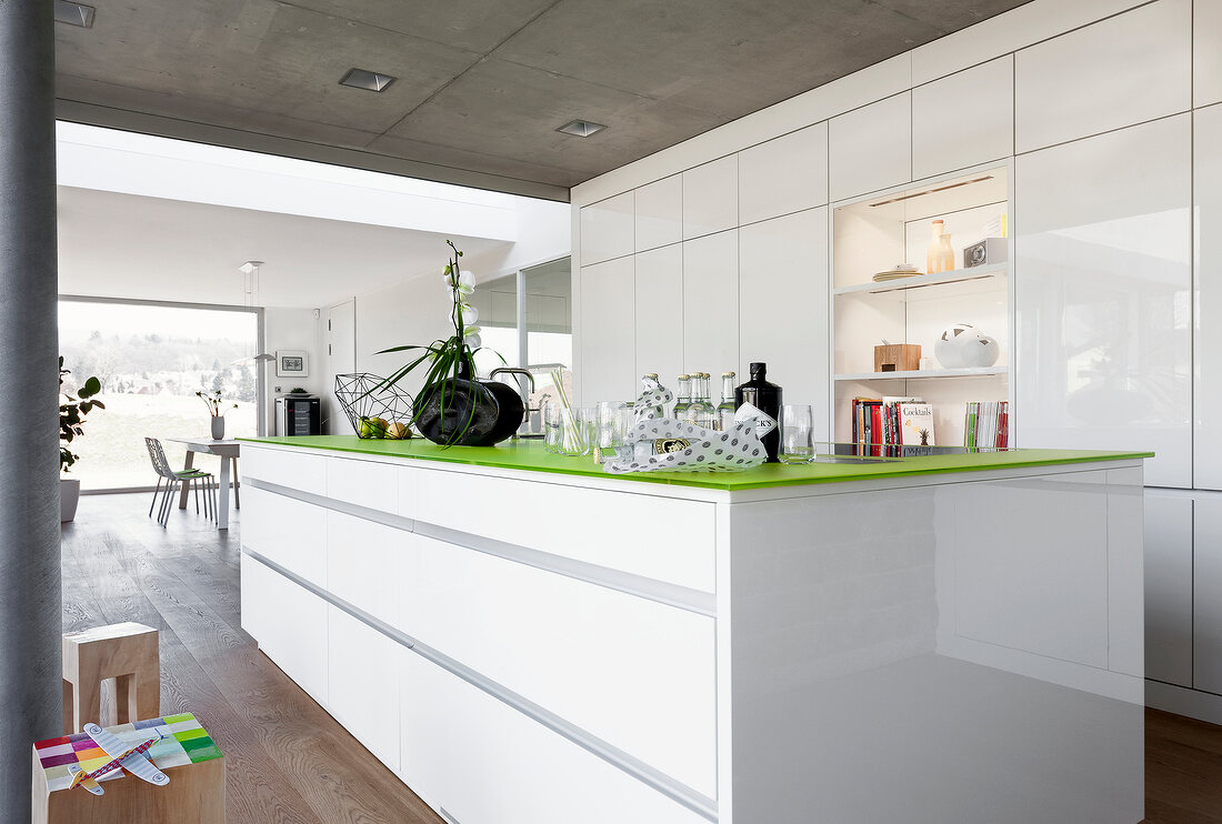 View of kitchen with various items on green counter top