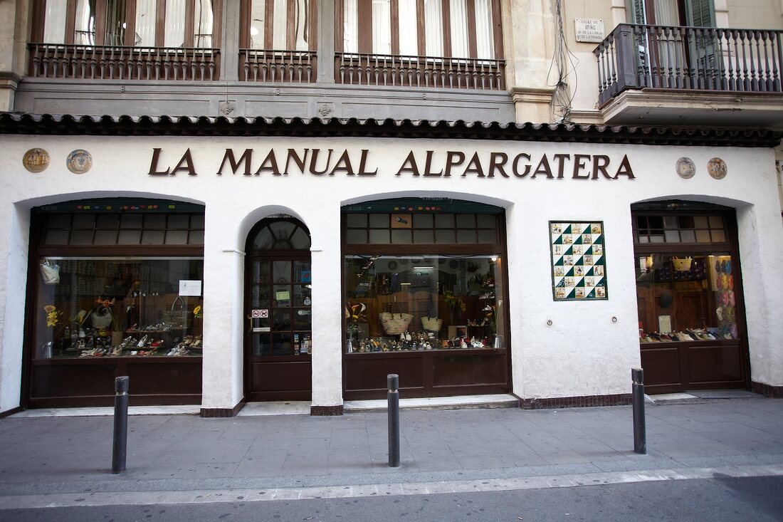 Exterior of La Manual Alpargatera and street in Barcelona, Spain