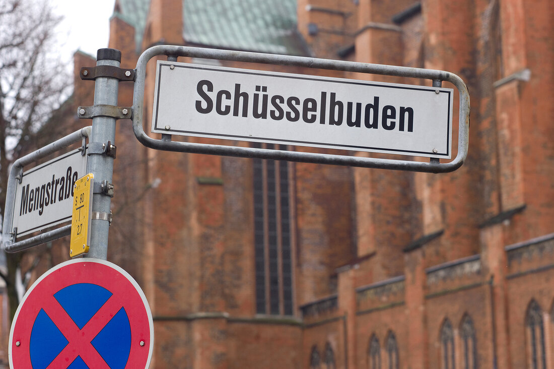 Close-up of signboard of Schusselbuden on street in Schleswig Holstein, Germany
