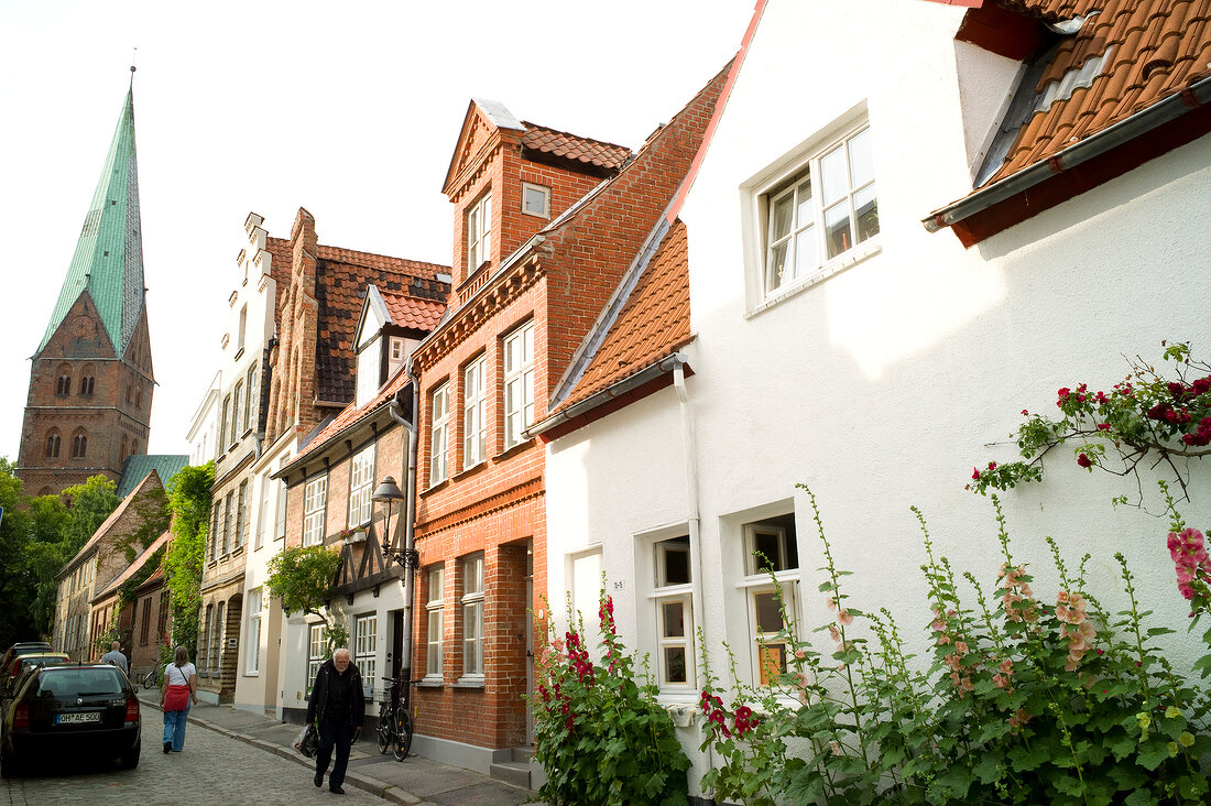 People on street near Aegidien Church, Lubeck, Schleswig Holstein, Germany