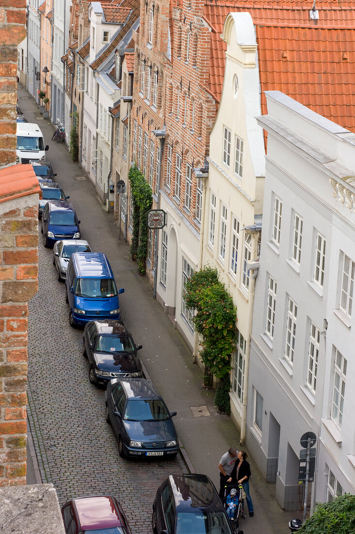 View of town library and cars parked on street, Lubeck, Schleswig Holstein, Germany