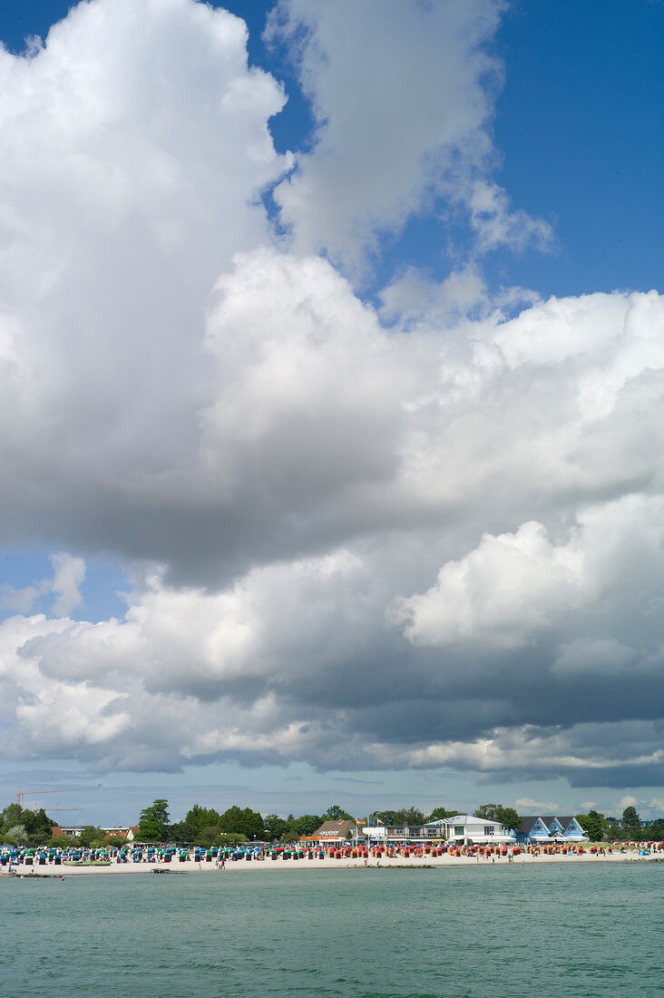 View of clouds and beach chairs on Gromitz beach in Schleswig Holstein, Germany