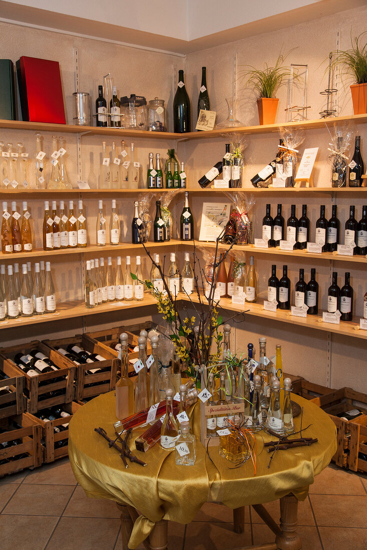 Wine bottles on shelves and table in Winery Faber store in Freiburg, Germany