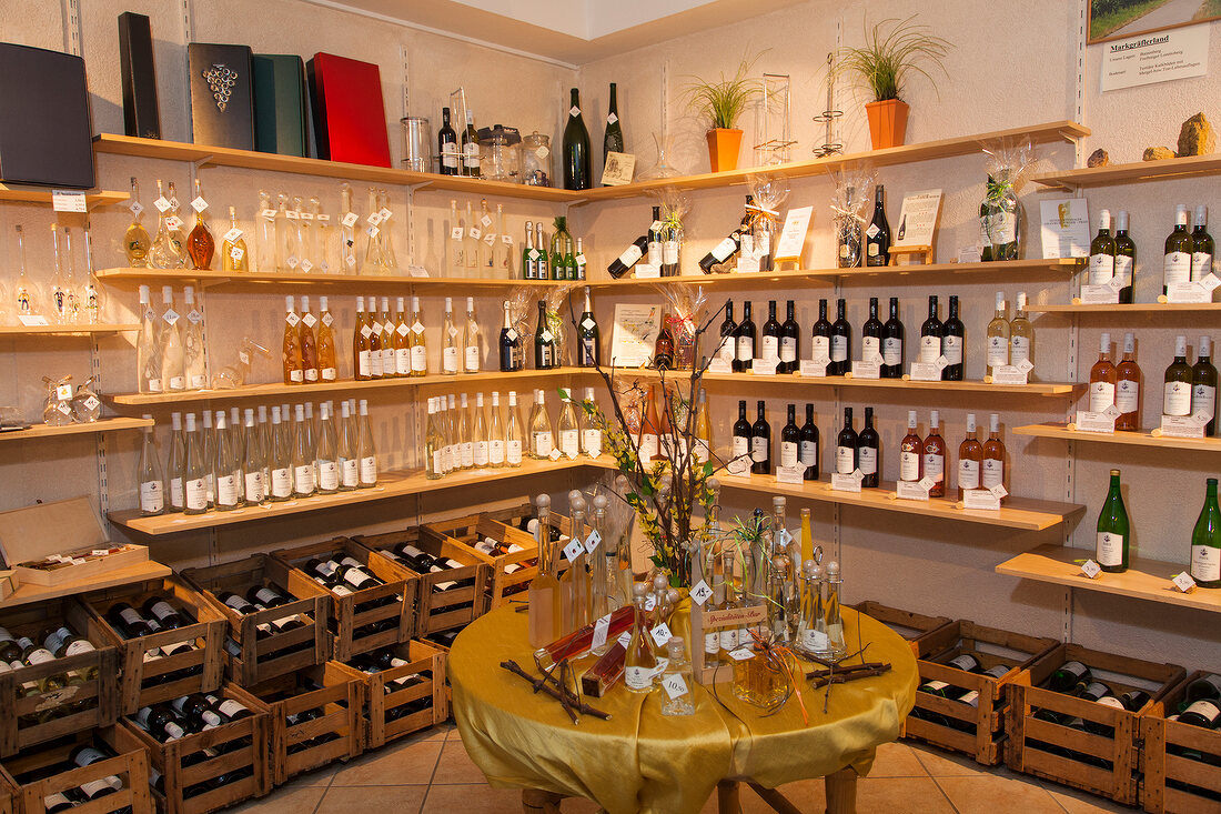 Wine bottles on shelves and table in Winery Faber store in Freiburg, Germany