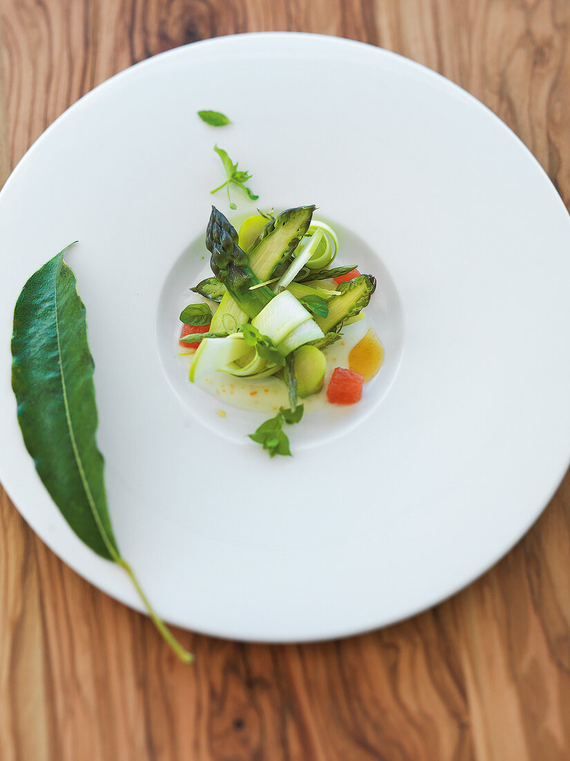 Close-up of asparagus and yogurt sauce on plate