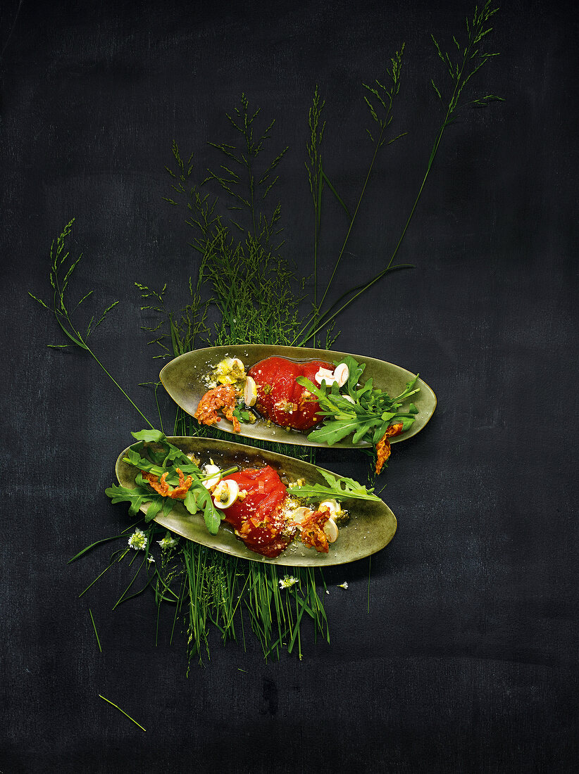 Different salad with tomato vinegar on serving dish