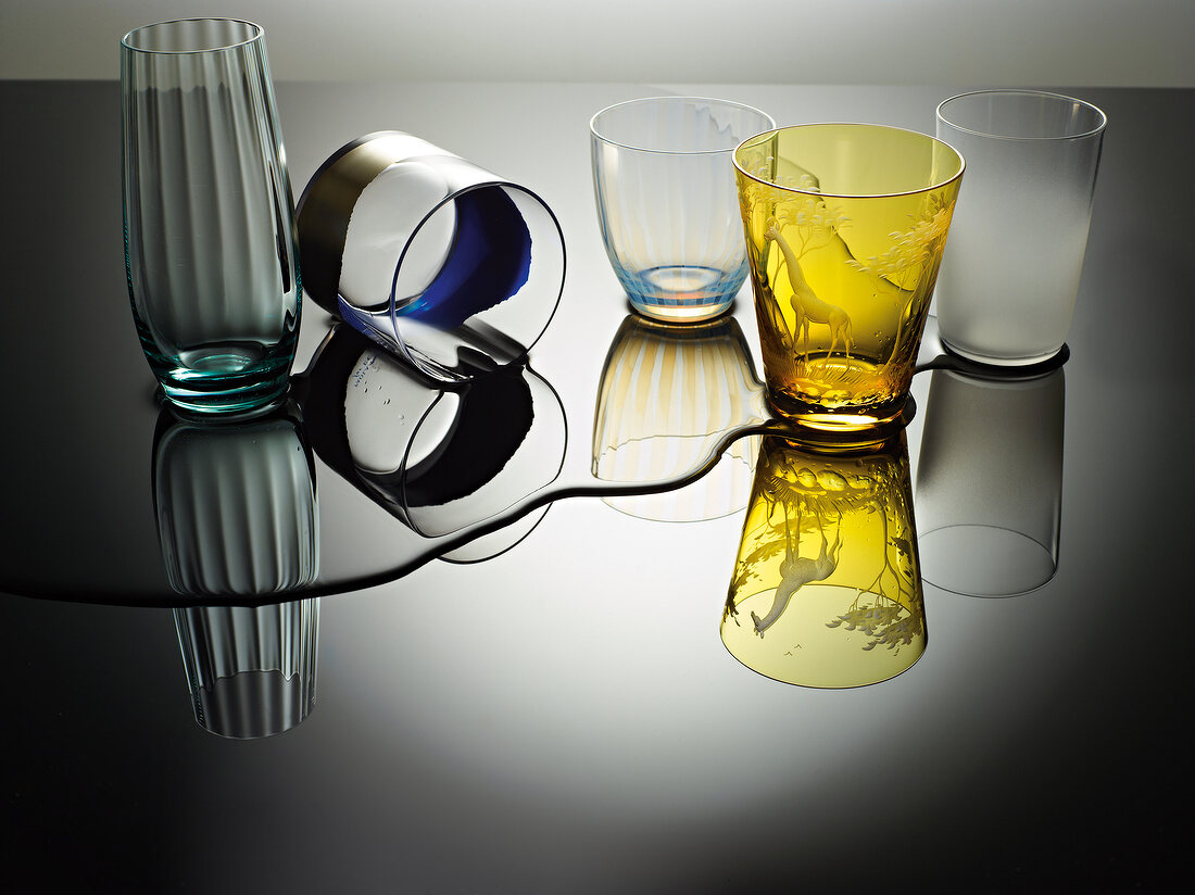Various glasses and spilt water on table