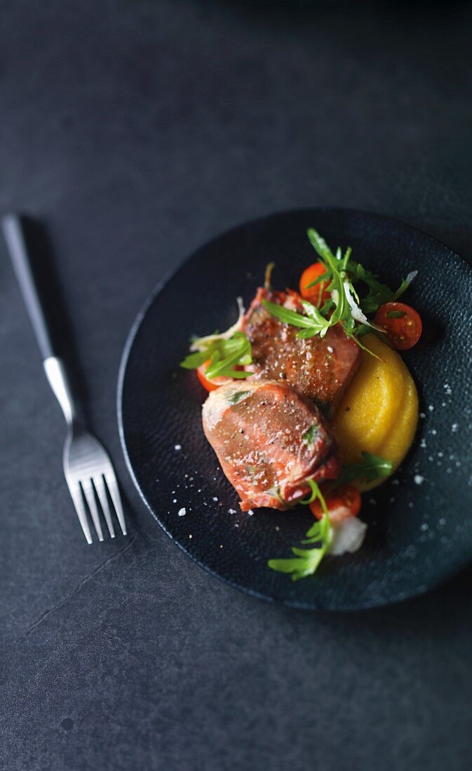 Stuffed veal medallions with apricots, Parma ham and sage