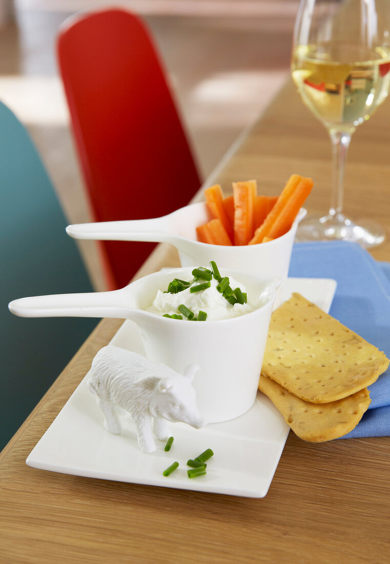 Carrot and dip with cracker on serving dish