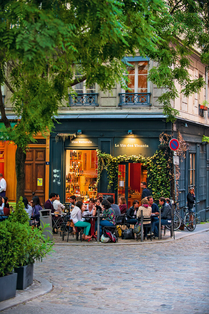 People sitting in Sidewalk in front of cafe, Lyon, France