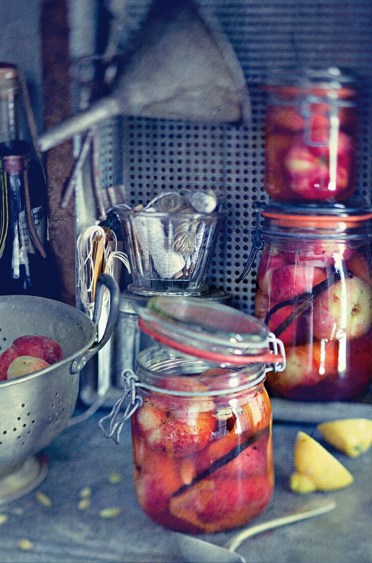 Peaches with vanilla syrup in preserving jars