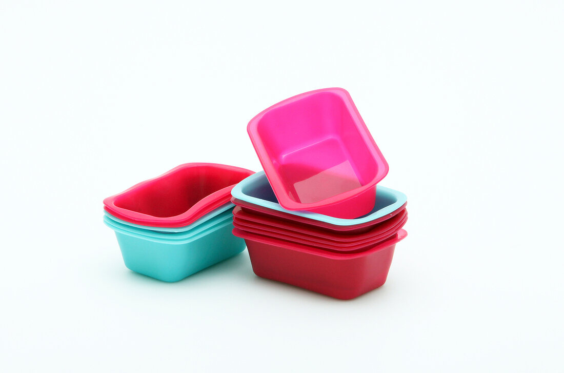 Colourful mini bake ware on white background