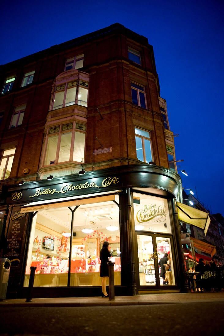 Low angle view of illuminated Cafe at evening in Dublin, Ireland