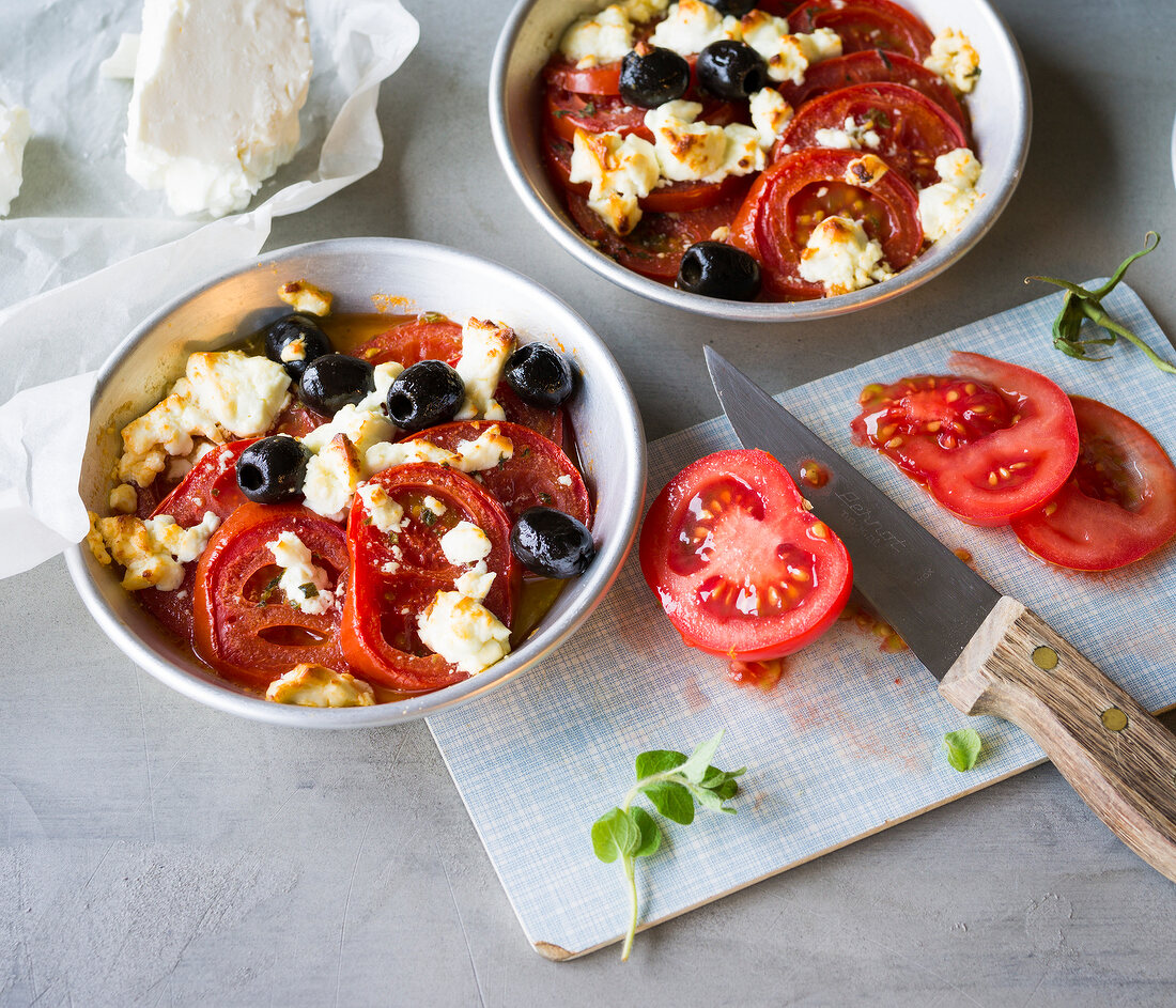 Tomato slices with feta cheese in bowls