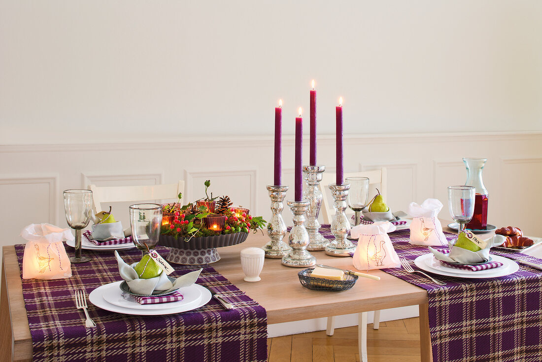 Table decorated with candles and tableware