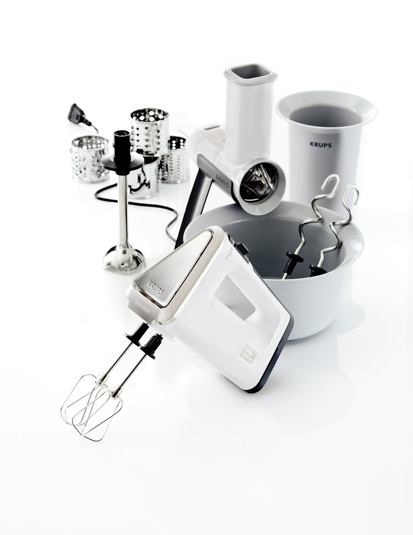 Three types of hand mixers on white background