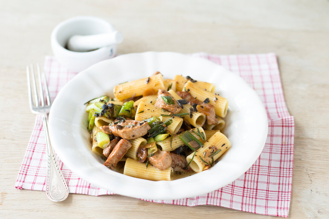 Rigatoni with fillets and truffle butter in bowl